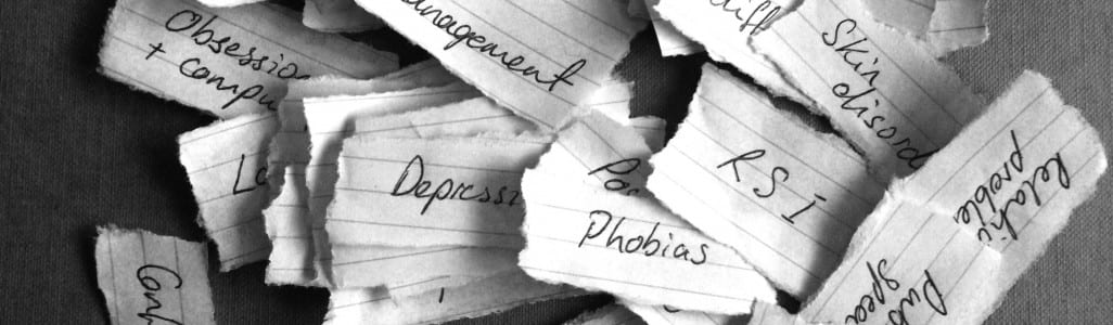 Pile of pieces of paper, each with the name of a stress written on